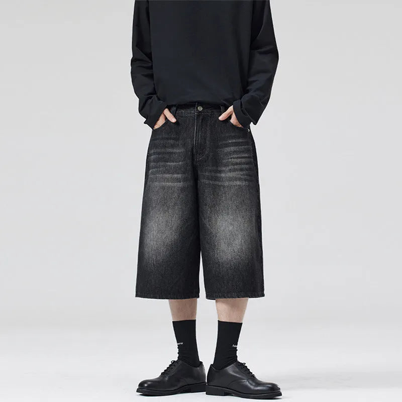 Men's light blue cotton denim shorts with a straight leg and cropped length on a hanger