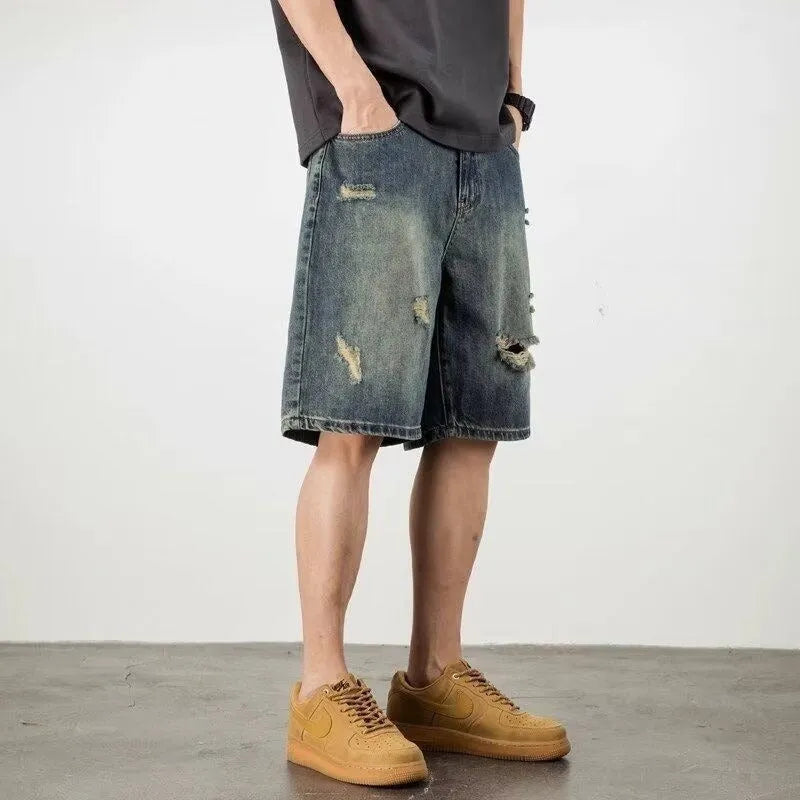 Blue retro denim men's shorts with distressed holes and straight leg cut