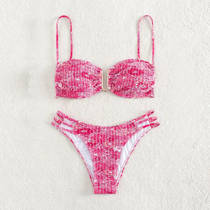 Women's high-waist floral bikini swimsuit on a hanger in blue, orange, pink, and rose red colours.