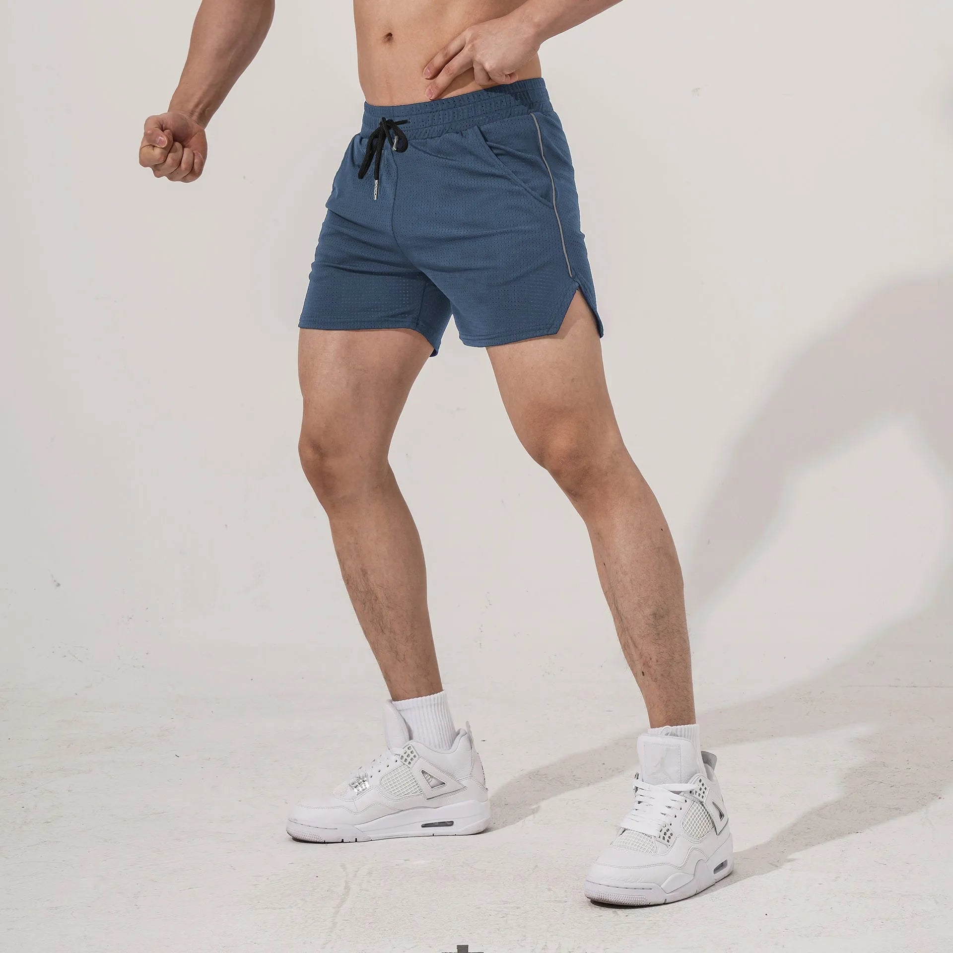 Men's straight-leg polyester sports shorts in black, available in sizes up to 3XL
