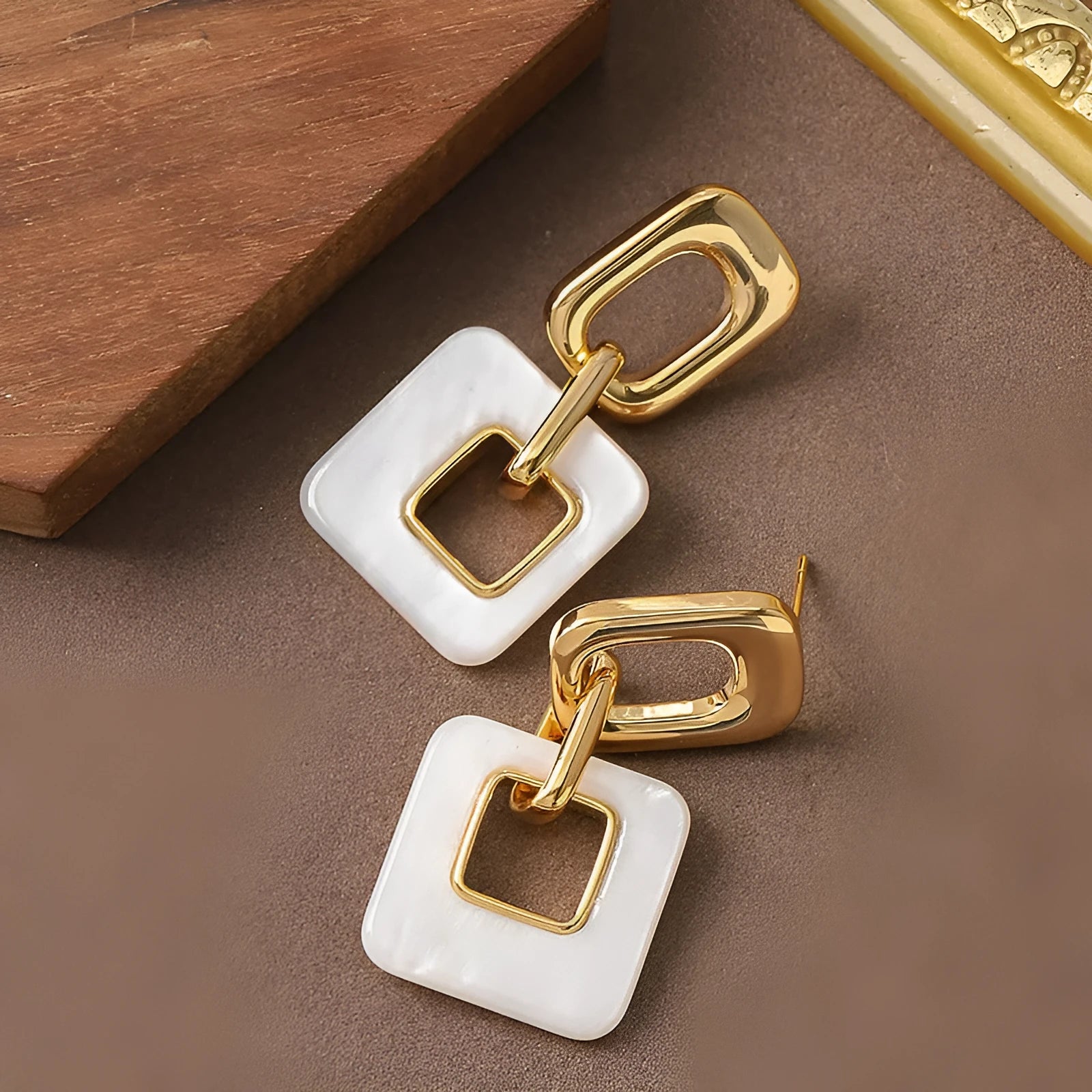 Geometric square hollow earrings with chamfered corners in electroplated copper
