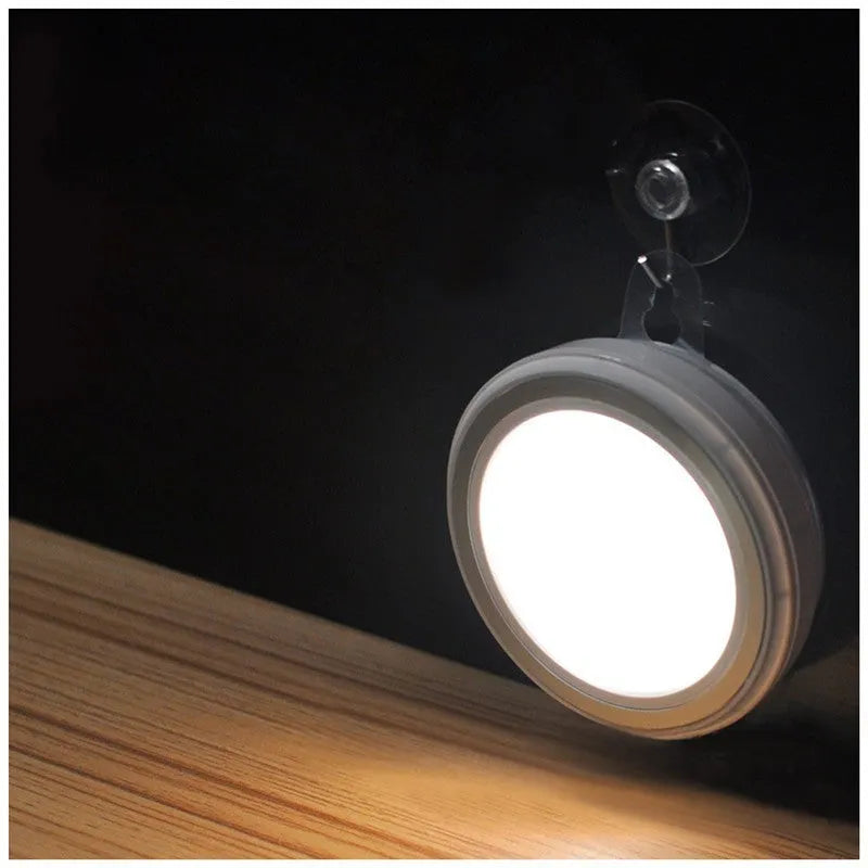 Round white motion sensor LED light with 80mm diameter for wardrobe and cabinet installation