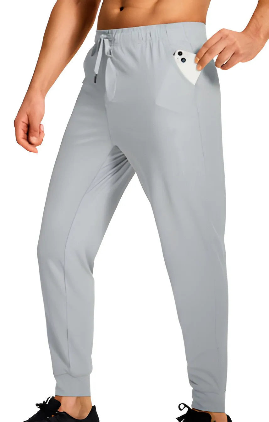Men's loose-fit solid colour casual trousers on a hanger, showing the relaxed leg cut.