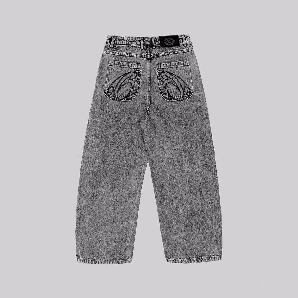 Grey loose-fitting straight-leg cotton denim trousers for men and women on a hanger