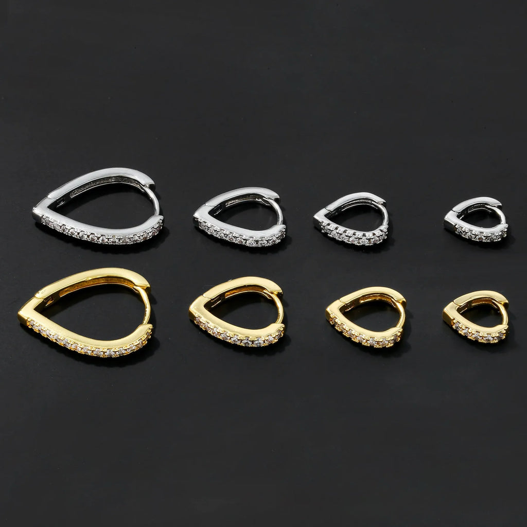 Geometric heart-shaped copper ear clip with electroplated gold finish, clip-on back visible