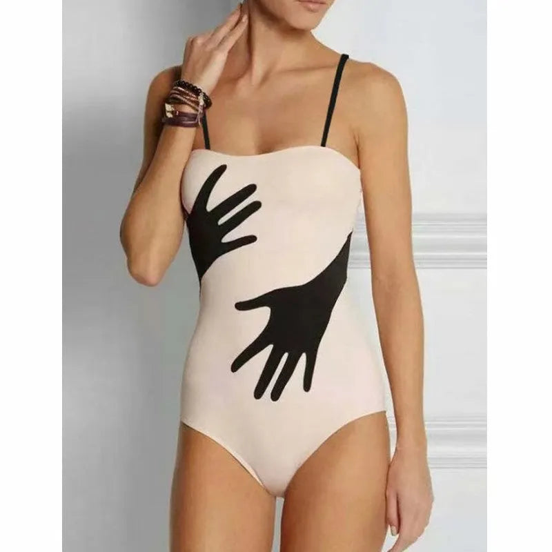 Patterned women's two-piece bikini swimsuit with a light tulle skirt.
