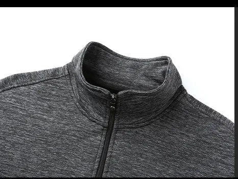 Men's black athletic jacket with a stand-up collar and front zip, showing a close-fitting cut