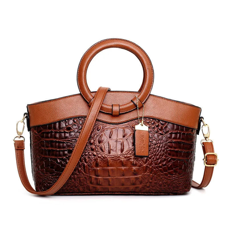 Fashion handbag in fabric with shoulder strap, showing internal phone and card compartments
