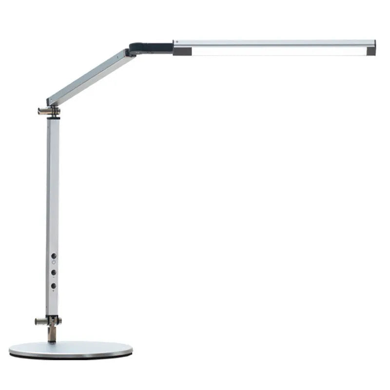 Folding aluminium desk lamp with a metal clip, shown in dazzling black, attached to a desk edge.