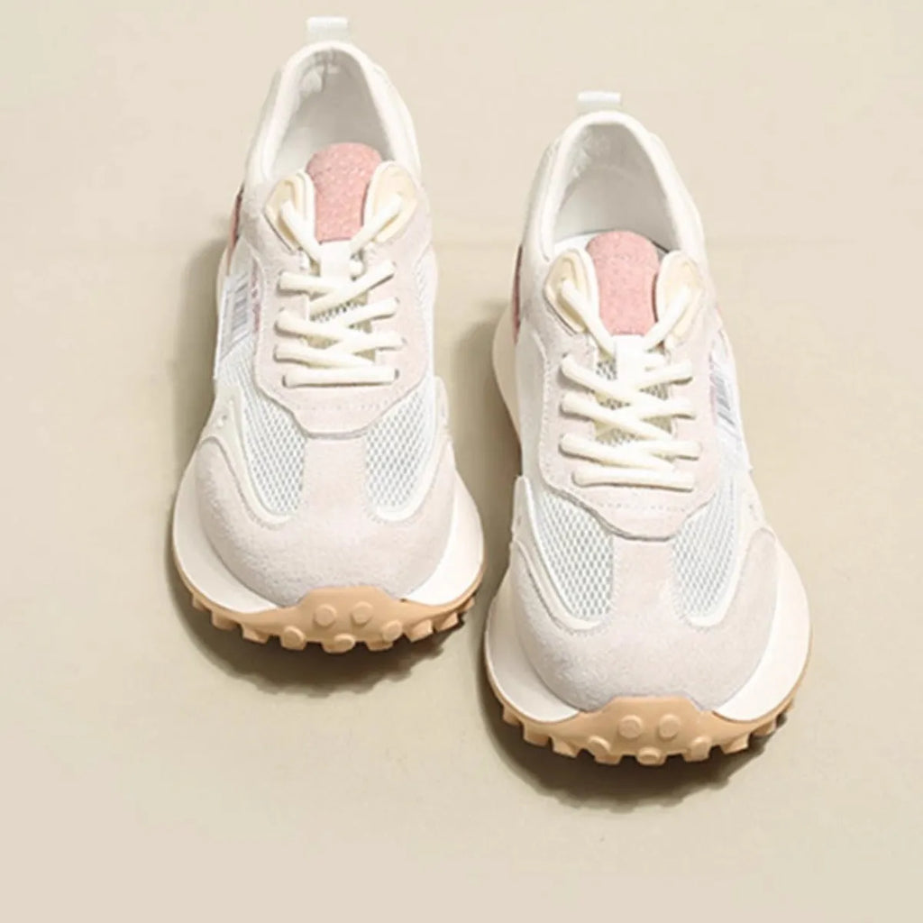 Women's low-top retro sneaker in grey with round toe, rubber sole, and mesh lining.