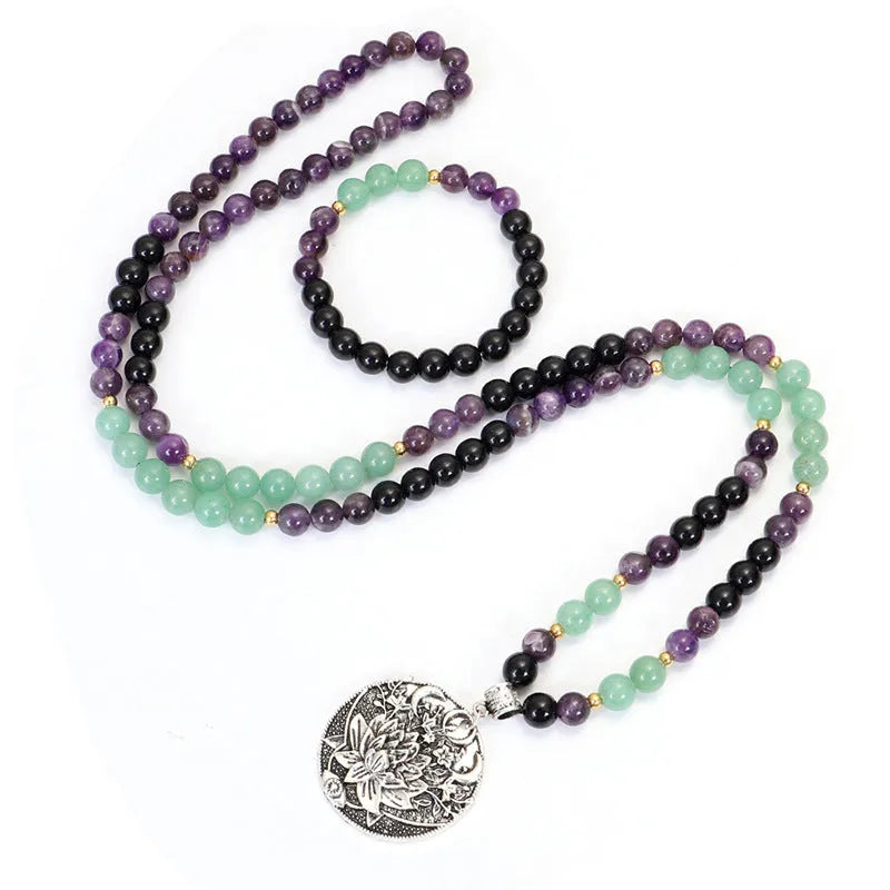 Dongling long yoga lotus pendant necklace and bracelet set with geometric alloy pendant and stone beads.
