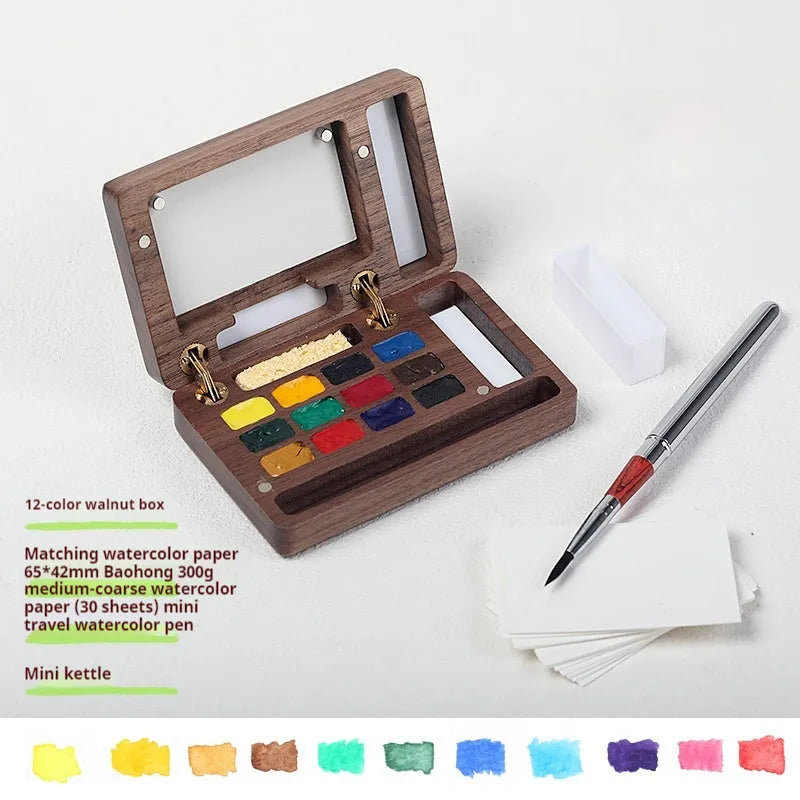 Mini wooden walnut watercolour paint box open showing pigment pans with choice of Schmincke, Holbein, Picasso, or Moonlight colour sets.