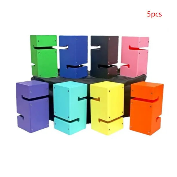 Set of coloured ABS plastic tower blocks with pull ropes and metal hook frame for outdoor team building games.