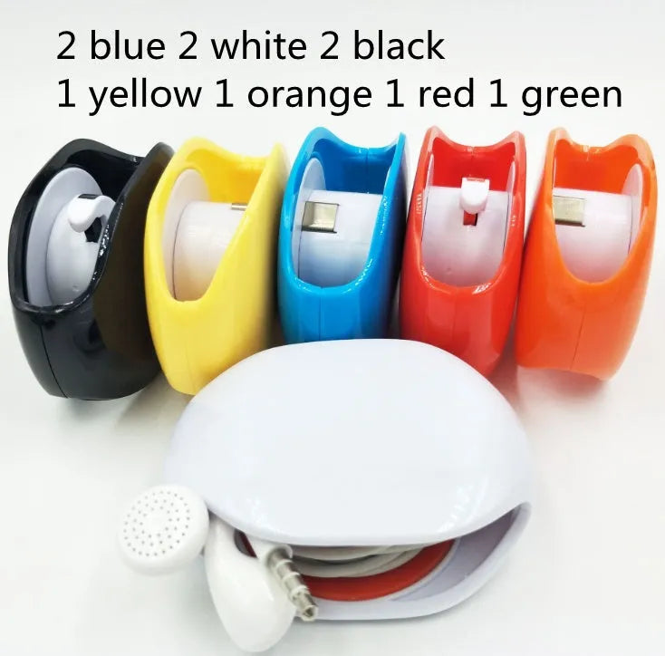 Automatic earphone retractor winder in black with extended cable showing push-type mechanism