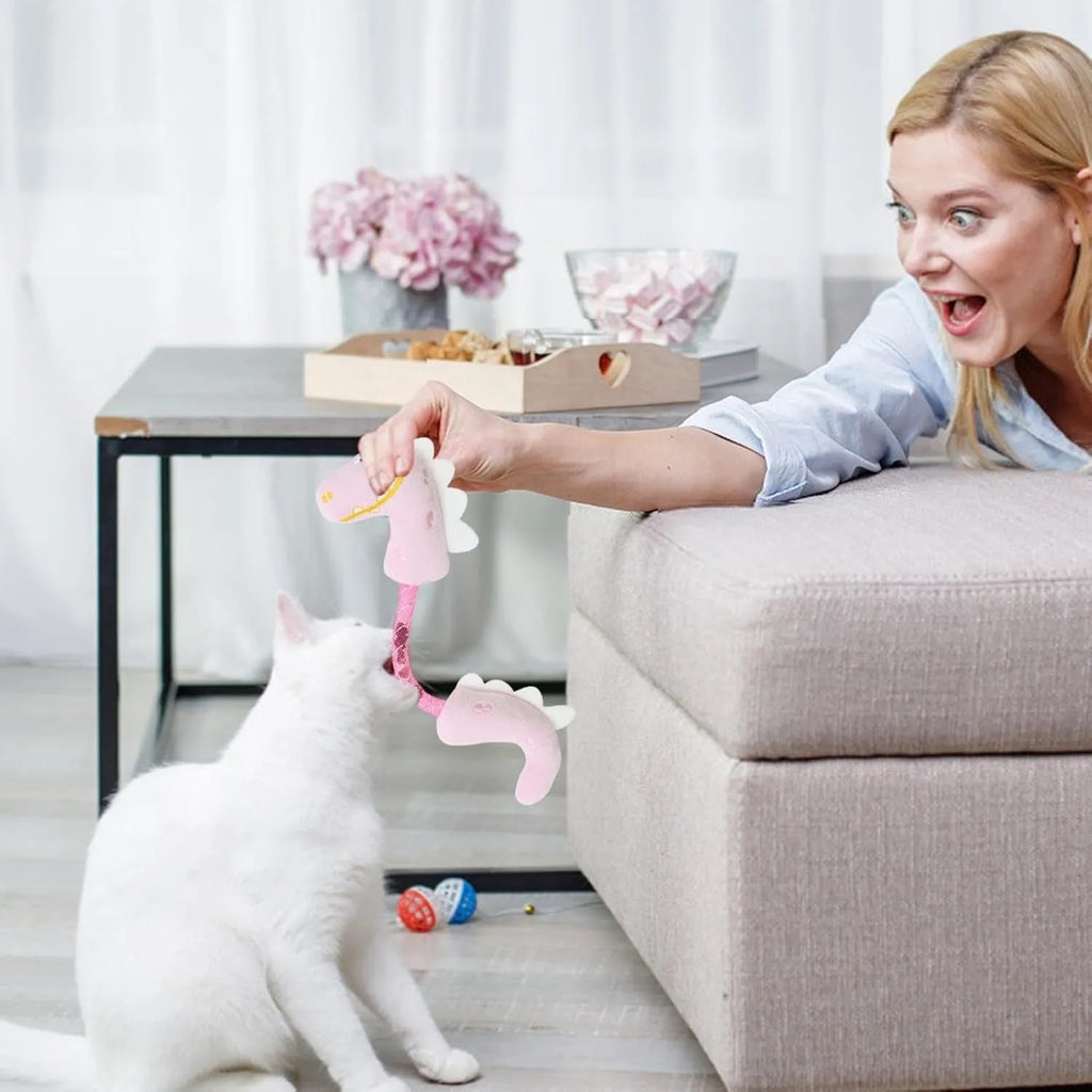 Bundle of four cat toys including chew toys, rope toys, springs and kicker toys in pink, purple and yellow colours