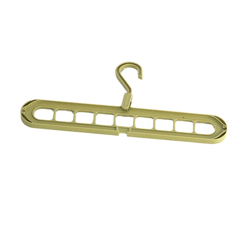 A green plastic multifunctional hanger with nine holes for trousers, shown in a folded and unfolded position.