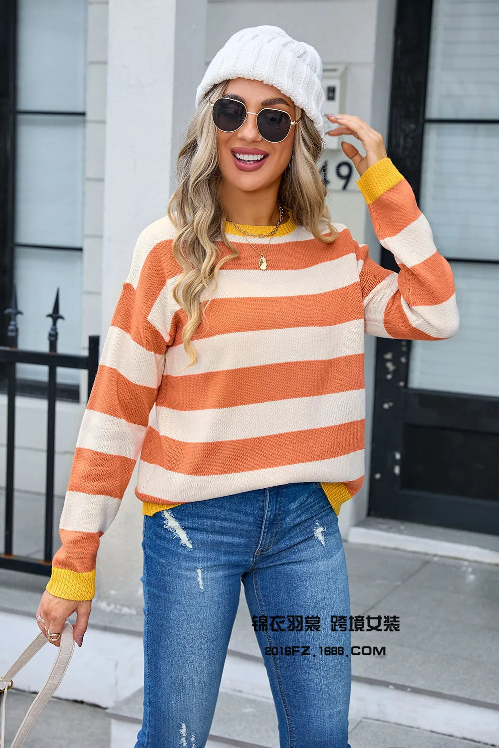 Women's loose-fit long sleeve floral sweater in blue, acrylic fabric, round neck.