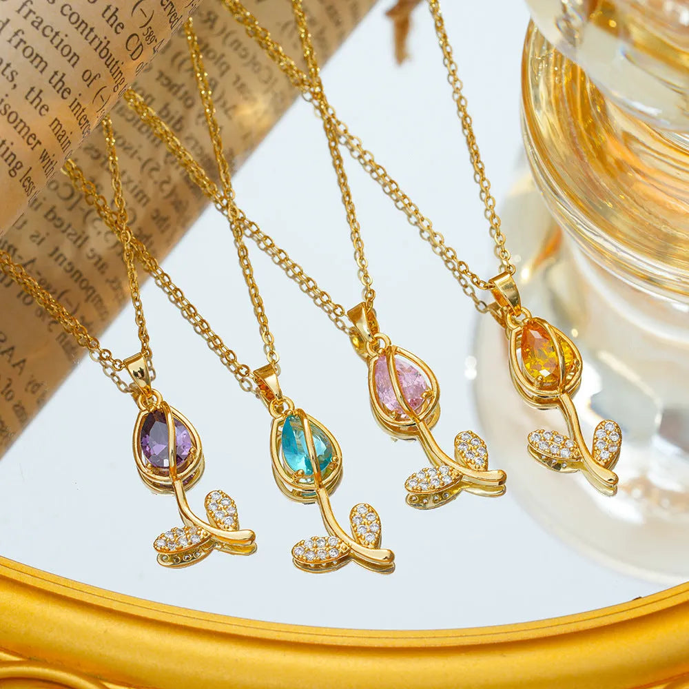 Gold electroplated titanium steel tulip necklace with adjustable chain and floral pendant