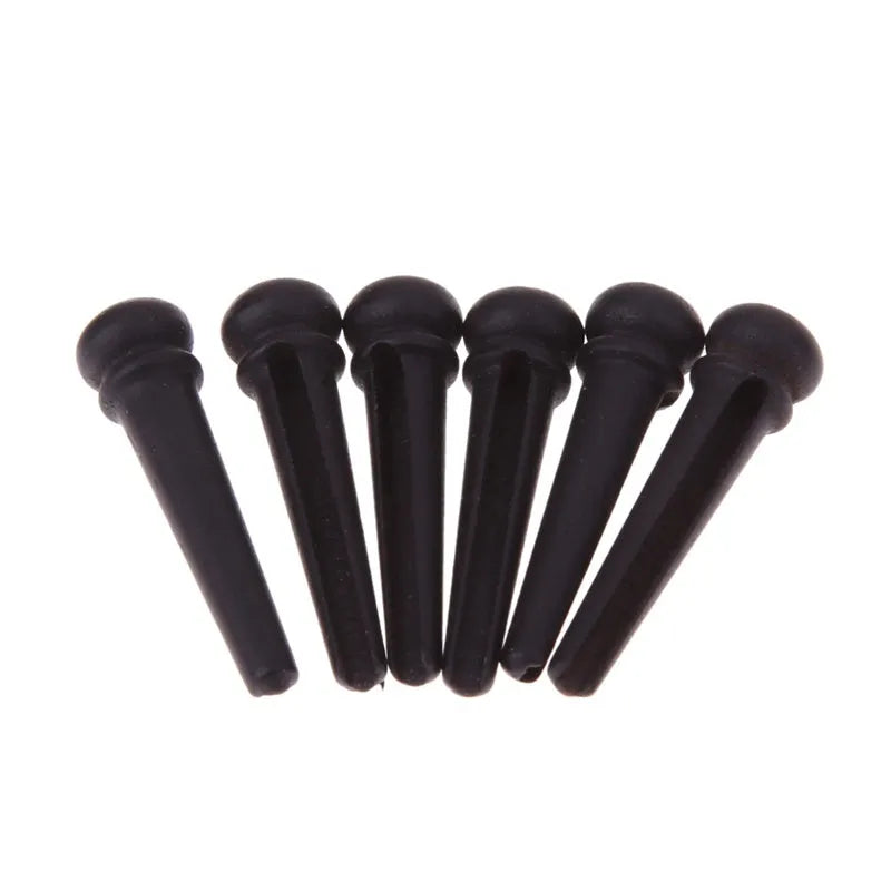 Set of six matt black ebony guitar string nails with 5.3mm bayonet diameter.