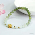 Hand-woven Hetian jade bracelet with sunshine water gradient colour and floral bead design.