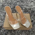 Women's black and silver high heel fashion boots with a PVC sole on a size label background.