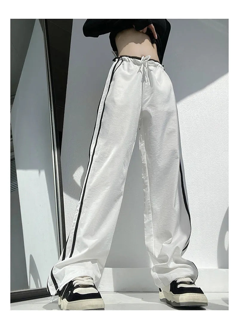 Women's navy blue loose straight trousers with white ribbon parallel bar waistband detail