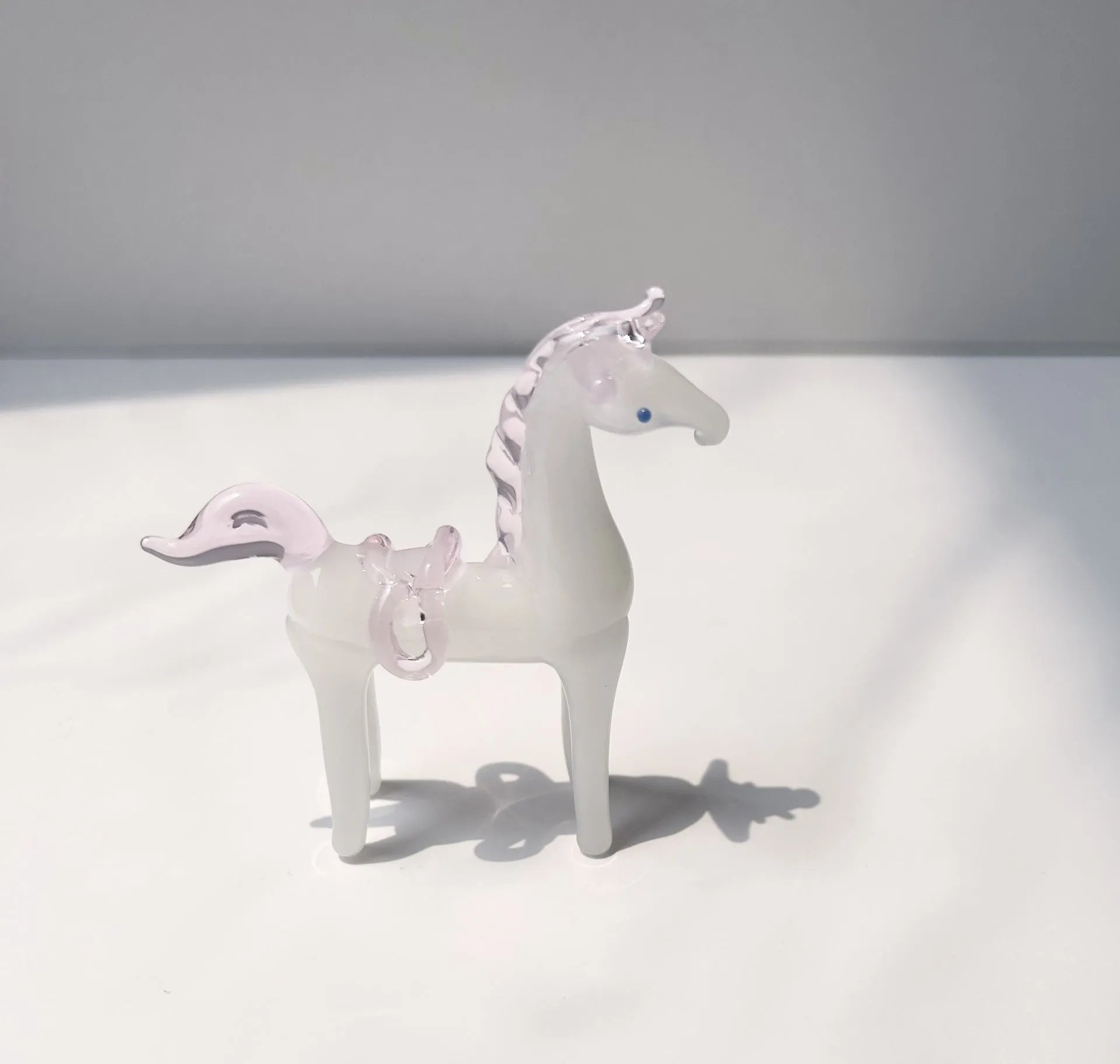 Brown glazed ceramic horse decoration on wooden desk with modern simplicity design