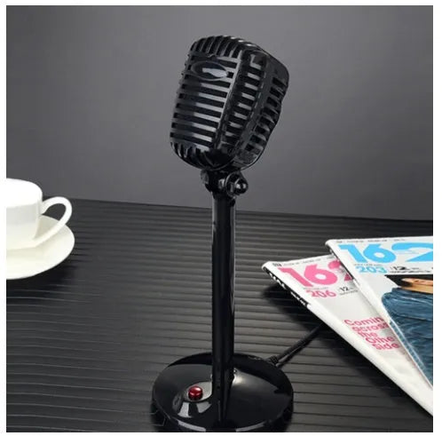 Black USB desktop computer microphone with adjustable stand on a desk.