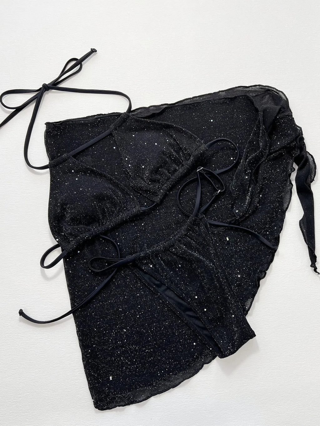 Black three-piece bikini swimsuit set showing separate top and shorts on mannequin
