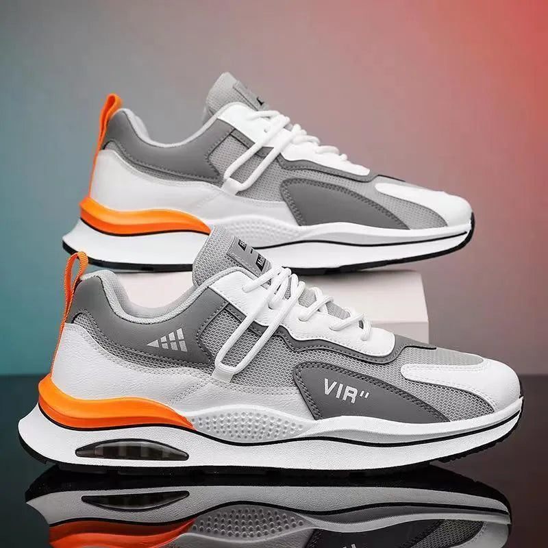 Men's gray and black mesh running shoes with a round toe and middle-top design on a white background.