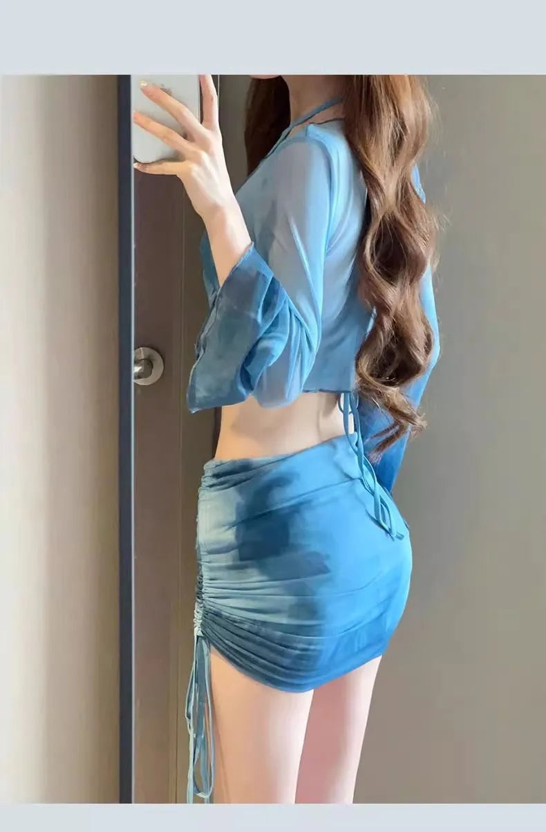 Women's four-piece high waist bikini set in blue and pink with skirt and backless top
