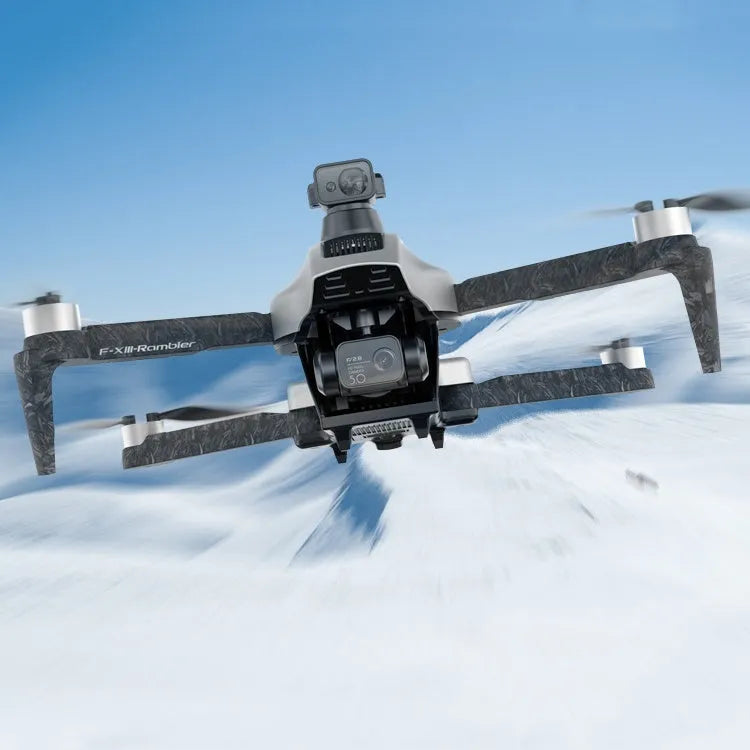 White foldable quadcopter drone with 4K camera and obstacle avoidance sensors, remote control, and batteries on a grey background.