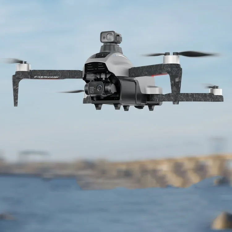 White foldable quadcopter drone with 4K camera and obstacle avoidance sensors, remote control, and batteries on a grey background.