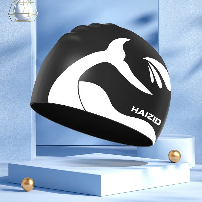 Silicone swimming cap with whale tail design and waterproof ear protectors in multiple colour options