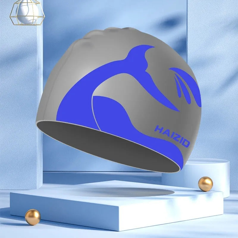 Silicone swimming cap with whale tail design and waterproof ear protectors in multiple colour options