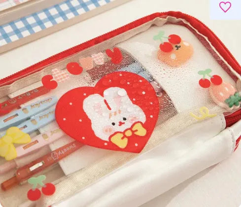 Transparent TPU pencil case with pink cake rabbit and red love rabbit designs for school stationery storage