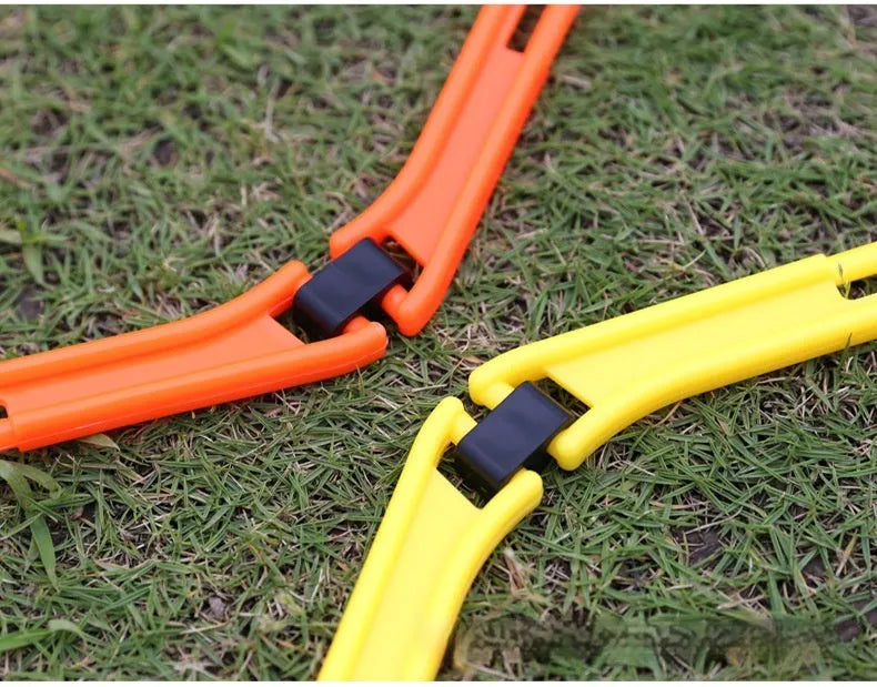 Set of six foldable hexagon football agility training rings in yellow green and orange plastic