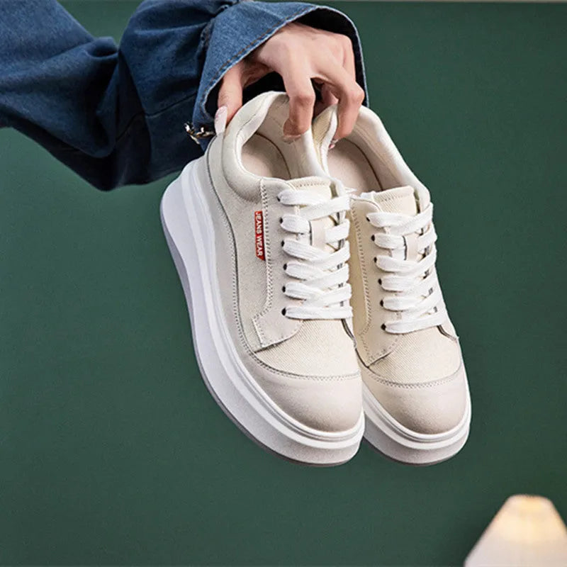 Women's beige leather thick-soled casual board shoes on a white background.