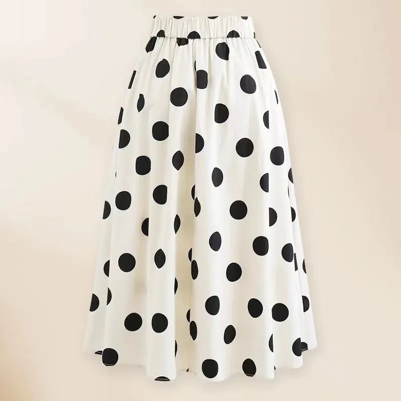 Female one-piece swimsuit with round skirt and bow detail in black or white polyester fabric for swimming and beach wear