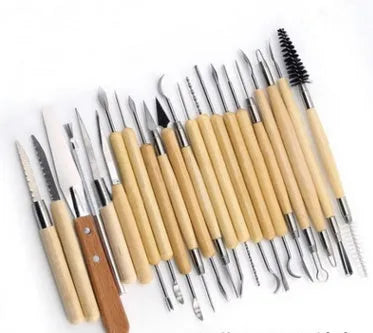 27-piece pottery clay tool set with stainless steel, wood, and plastic tools in roll-up storage bag