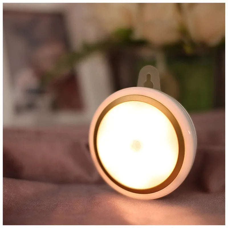 Round white motion sensor LED light with 80mm diameter for wardrobe and cabinet installation