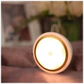 Round white motion sensor LED light with 80mm diameter for wardrobe and cabinet installation