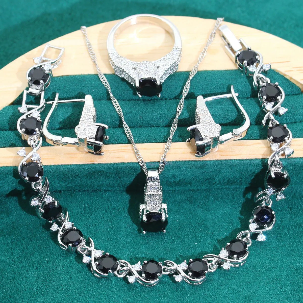 Four-piece bridal jewellery set with necklace, bracelet, earrings, and ring in alloy with zircon detail