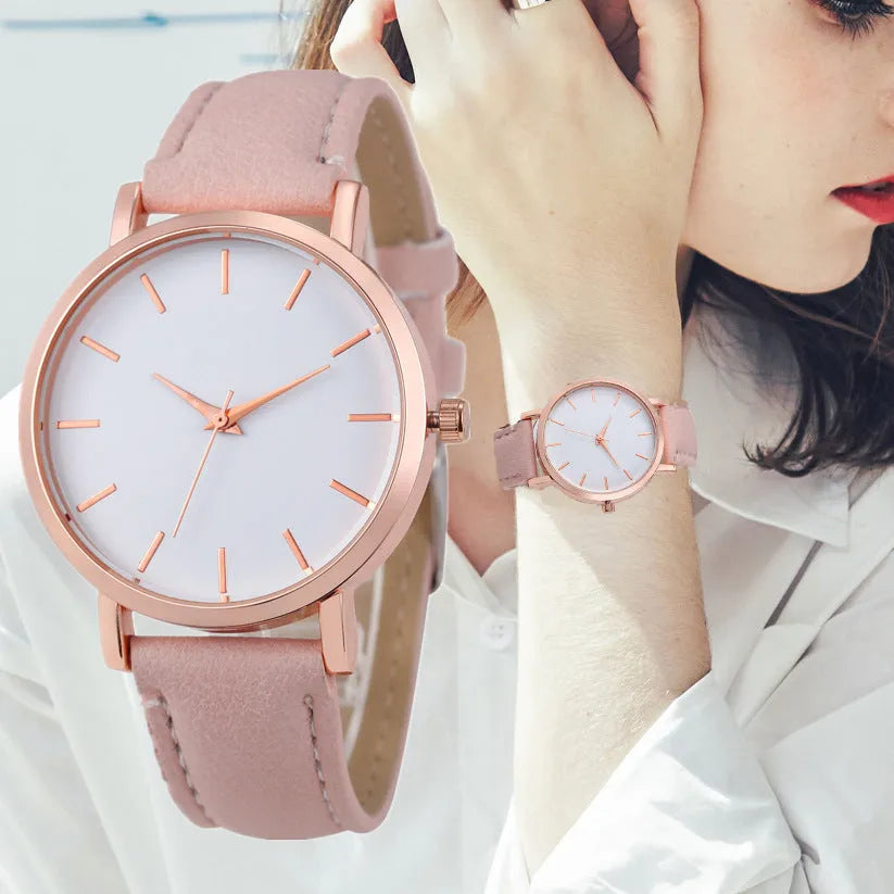 Square-faced quartz watch with an alloy case and PU leather strap on a wrist.