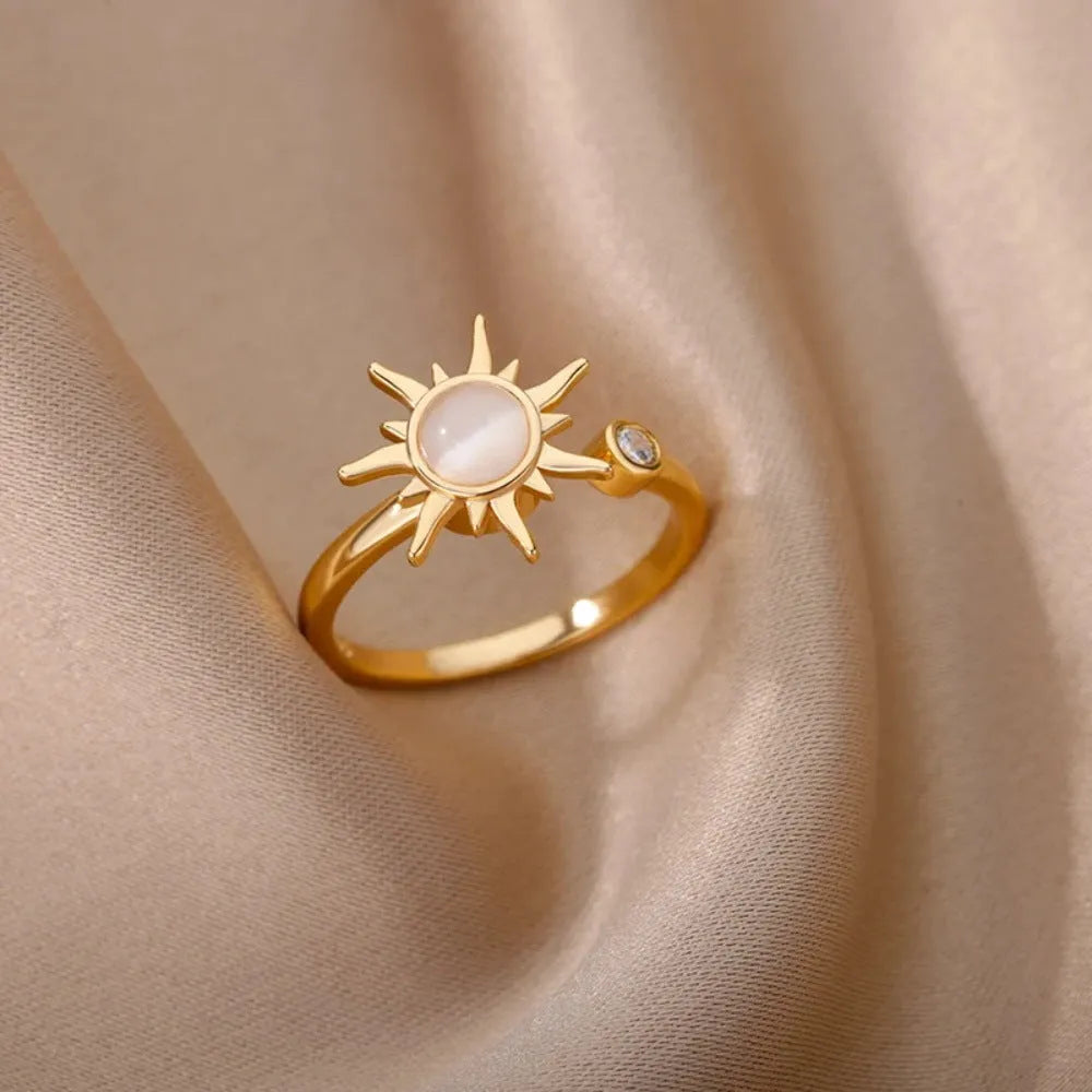 Rotatable decompression ring with adjustable opening in gold electroplated finish