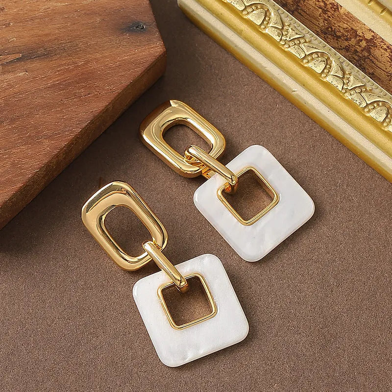 Geometric square hollow earrings with chamfered corners in electroplated copper