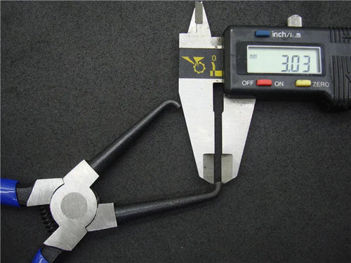 Caliper tubing pliers with iron construction and rubber handles for fuel line connector removal