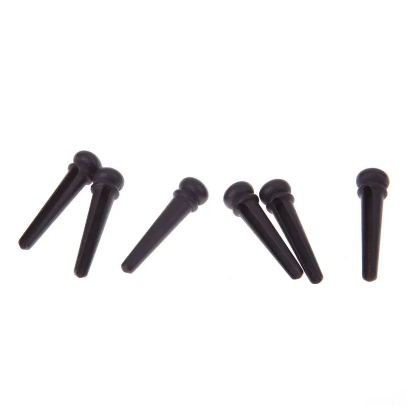 Set of six matt black ebony guitar string nails with 5.3mm bayonet diameter.