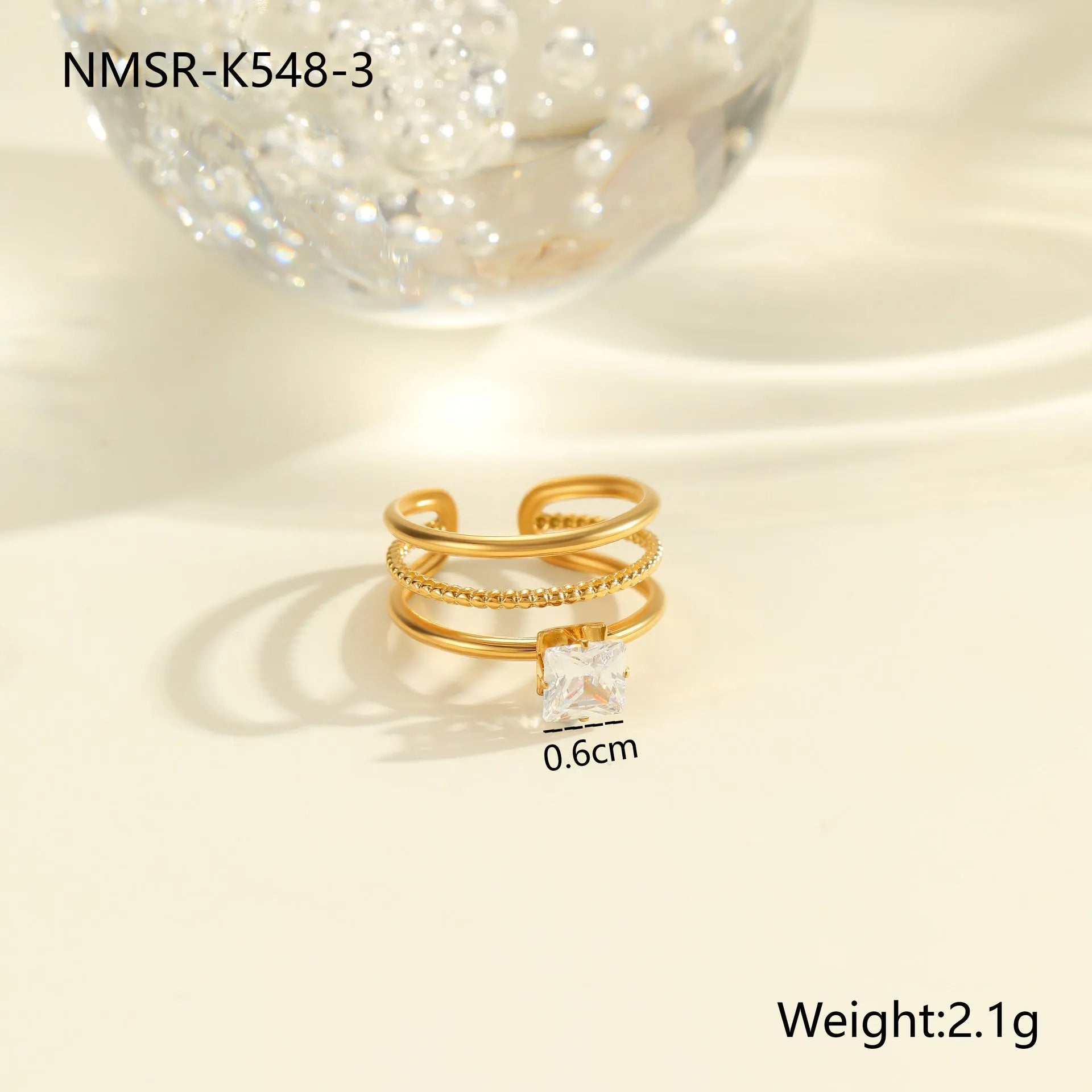 Gold-coloured stainless steel open ring with zircon stones in a geometric heart design.