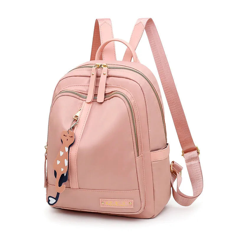 Women's black nylon casual backpack with double shoulder straps showing three-dimensional outer pockets